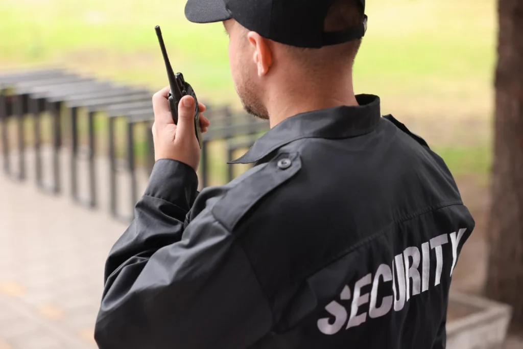 Security guard using a walkie-talkie for Commercial Property Security Vancouver